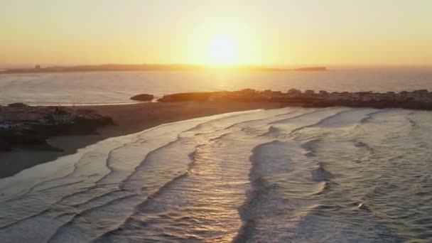 Aerial footage of the coastal town during a golden hour — Stock Video