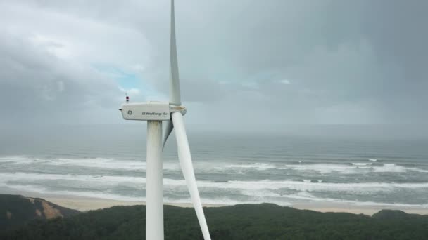 Close-up shot of a wind turbine on the shore of the Atlantic — Stock Video
