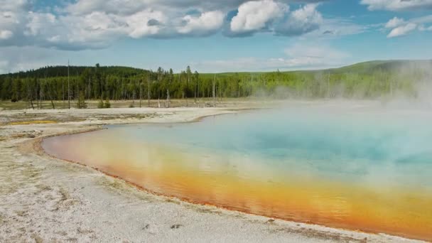 Cinematic wilderness panorama of colorful geyser in Yellowstone National park 4K — Stock Video