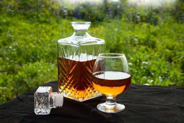 Carafe with a glass of brandy — Stock Photo, Image