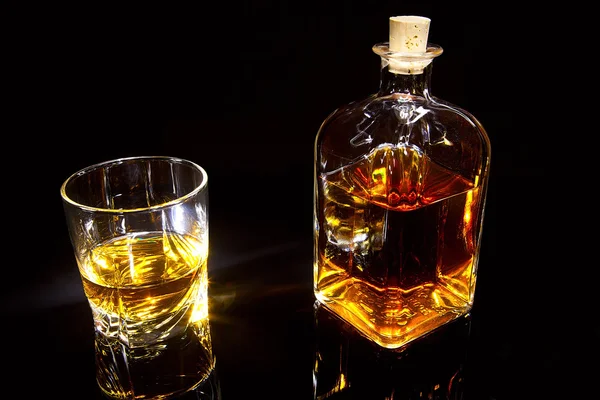 Bottle and glass of whiskey — Stock Photo, Image