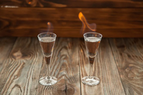 Shot glasses with alcohol on fire