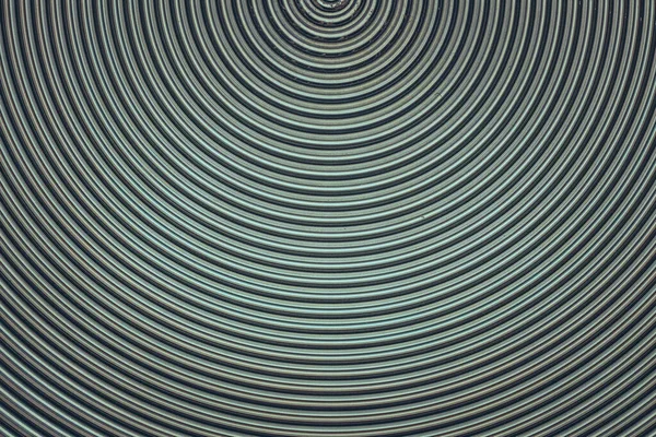 Sarmal desenli alüminyum metal yüzey yakın çekim fotoğraf arkaplanı.