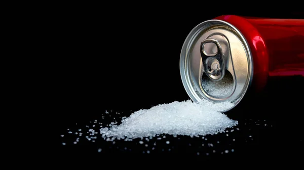 Cans of sugary drinks pour out separately on black background, concept of comparing sugar content of refreshing drinks.