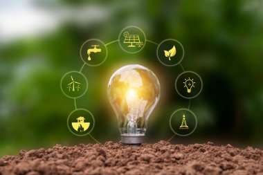 Işıldayan enerji tasarrufu lambası ve Dünya tabanlı enerji ikonu, enerji ve çevre kavramı.