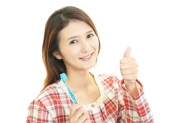 The woman who brushes her teeth — Stock Photo, Image