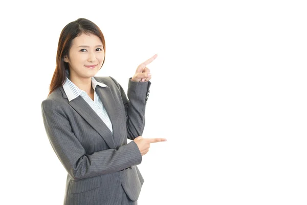 Mujer de negocios mostrando algo en el señalamiento — Foto de Stock