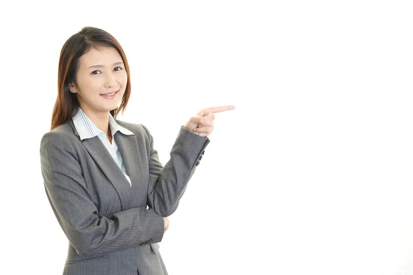 Business woman showing something on the pointing — Stock Photo, Image