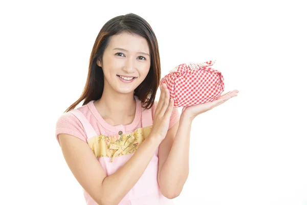 Woman holding a lunch box — Stock Photo, Image
