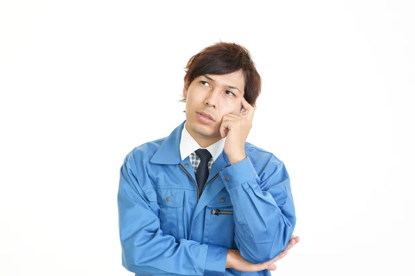 Tired and stressed Asian worker — Stock Photo, Image