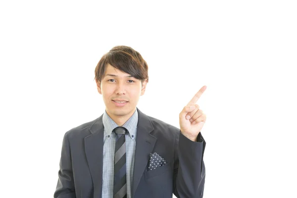 Hymyilevä aasialainen liikemies — kuvapankkivalokuva