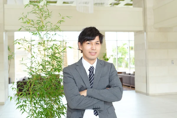Mosolygó ázsiai üzletember — Stock Fotó