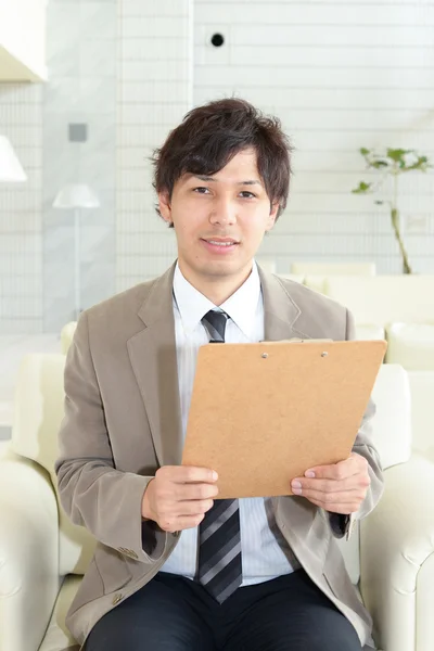 Smiling Asian businessman Stock Image