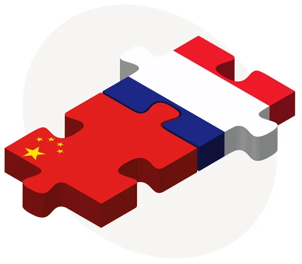 Čína a Francie vlajky v puzzle — Stockový vektor