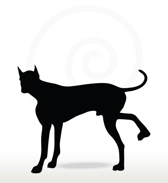 Silueta de perro en pose levantada pierna — Vector de stock