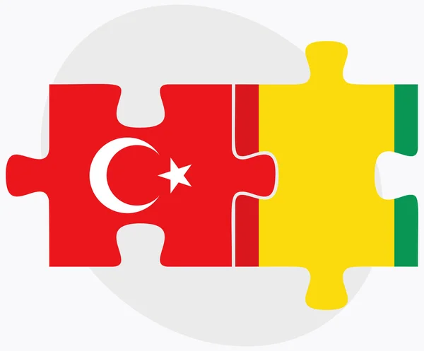 Turkiet och Guinea flaggor i pussel — Stock vektor