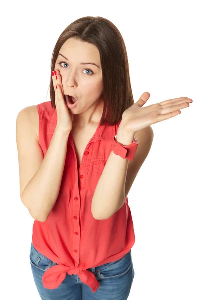 Pretty brunette in blue jeans and a red shirt on white background — Stock Photo, Image