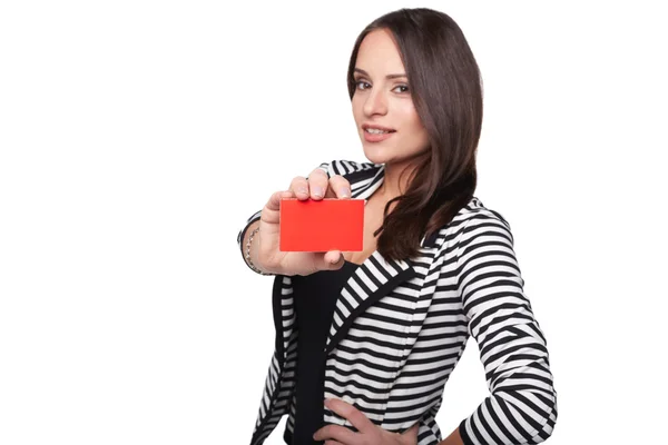 Close-up portrait of female holding credit card, shallow depth of field, focus on the card, over white background — Stock Photo, Image