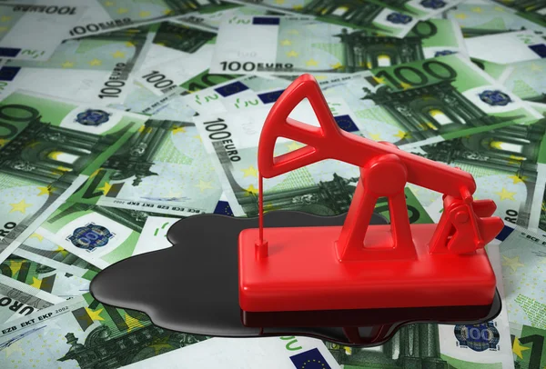 Czerwony Pumpjack i rozlany olej na euro — Zdjęcie stockowe