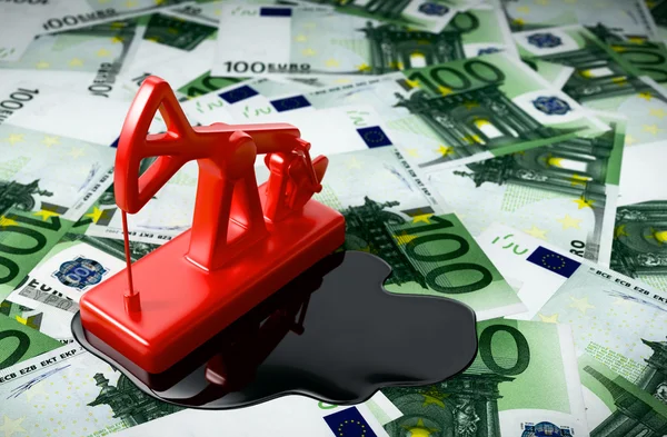 Red Pumpjack и пролитое масло на евро — стоковое фото