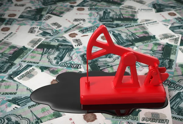 Abóbora vermelha e óleo derramado sobre rublos russos — Fotografia de Stock