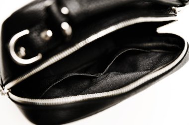 women's handbag in black on a white background. details of a female leather bitch. crocodile skin texture. bag for a business lady. exclusive handbag