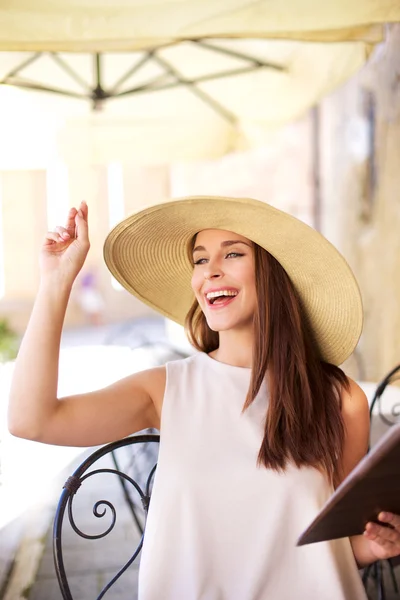 Young women calling the waitress — Stock Photo, Image