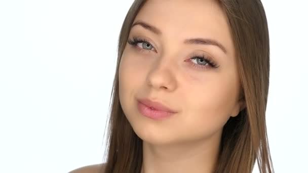 Face closeup of the girl on a white background, slow motion 100fps — Stock Video