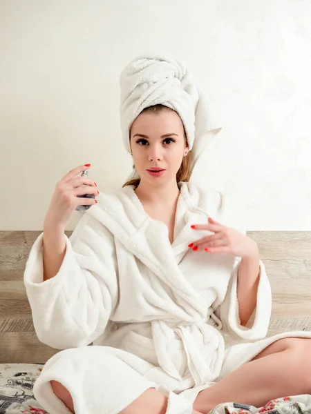 Young Beautiful Woman Bathrobe Sprinkles Perfume Herself — Stock Photo, Image