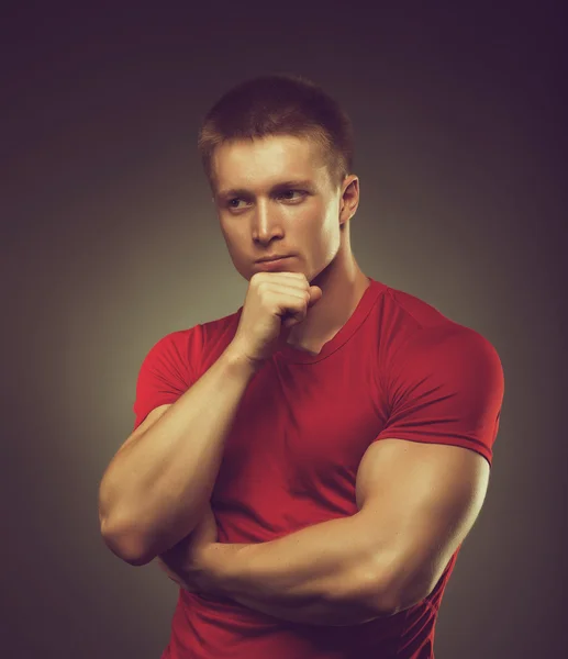 Healthy muscular young man  posing in studio — Stock Photo, Image