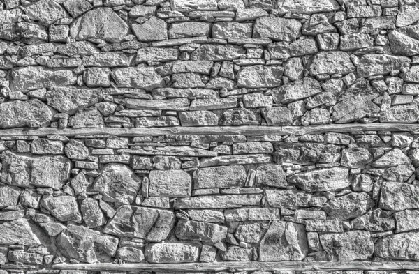 Parede de pedra fundo em preto e branco — Fotografia de Stock
