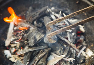 Preparation of fire for cooking clipart
