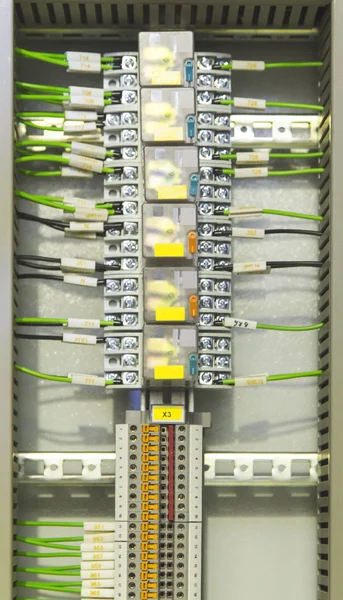 Electrical terminals and relays in industrial control panel — Stock Photo, Image