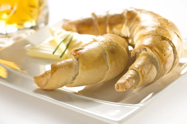 Baked beer rolls with butter — Stock Photo, Image