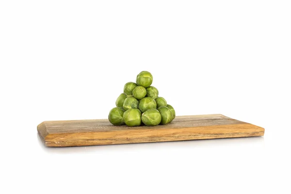 Brussel sprouts on a wooden board — Stock Photo, Image