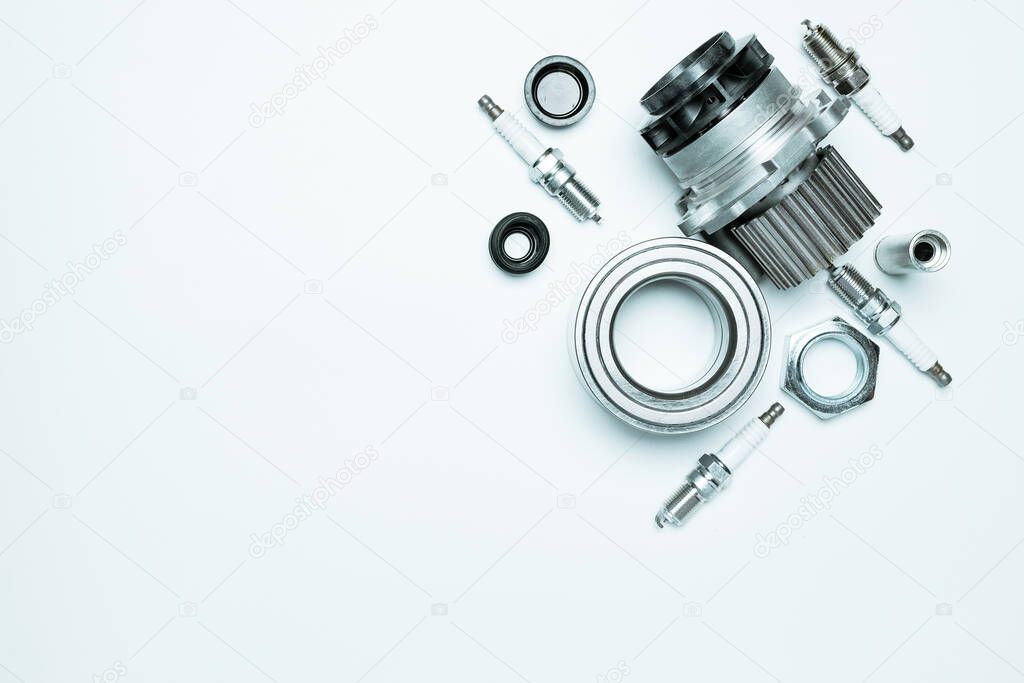 Car service. Auto motor mechanic spare or automotive piece on white background. Set of new metal car part. Repair and vehicle service with space for text