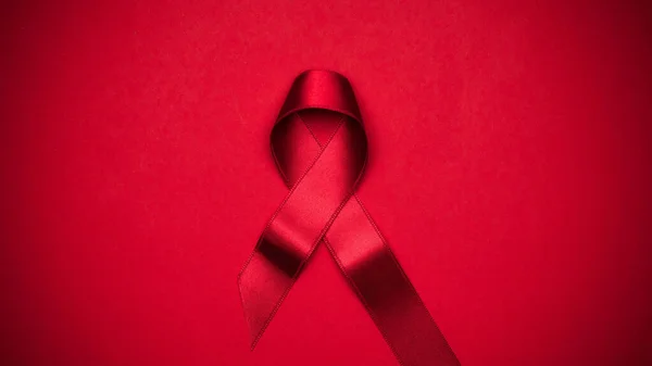 Σύμβολο Μόλυνσης Κόκκινη Κορδέλα Σύμβολο Hiv Παγκόσμια Ημέρα Σκούρο Κόκκινο — Φωτογραφία Αρχείου