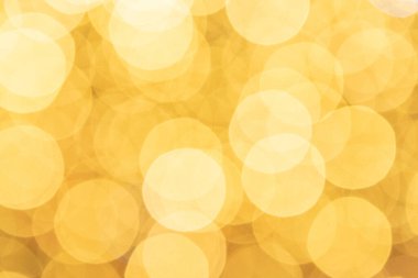Arka planda şenlikli altın. Soyut parıltılı Bokeh bulanık ışıklar. Odaklanmamış kış arkaplanı