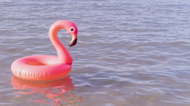 Yaz zamanı. Mavi okyanus suyunda pembe şişirilebilir flamingo. Deniz yazı plajı arka planı için. Çocuklar için komik bir oyuncak.