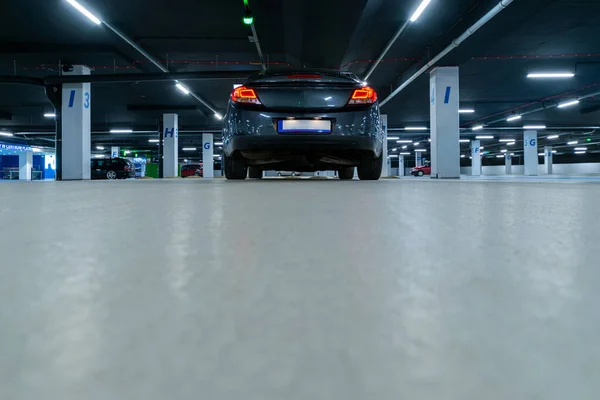 Parking space. Empty road asphalt background. Car lot parking space in underground city garage. Hidden underground carpark.