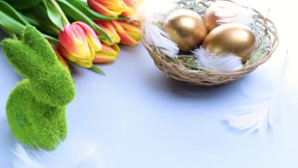 Easter Eggs Basket Golden Egg Basket Spring Tulips White Feathers — Stock Video