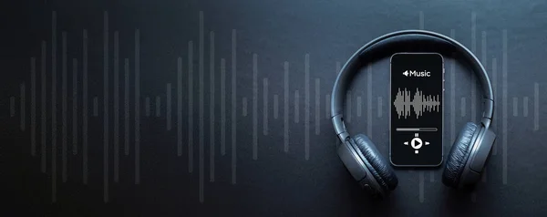 Music audio equipment. Audio beats, sound headphones, music application on mobile smartphone screen. Recording sound voice on dark background. Live online radio player mockup banner