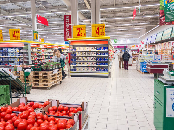 Zabrze. Poland 8 Maj 2021. Shopping mall entrance in Platan City Center. People shopping in modern commercial mall center. Interior of retail centre store in soft focus. For background use
