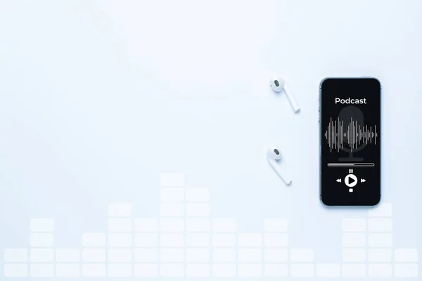 Podcast audio equipment. Audio microphone, sound headphones, podcast application on mobile smartphone screen. Recording sound voice on white background. Live online radio player mockup banner