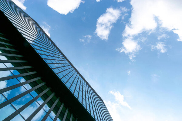 Office buildings. Finance corporate architecture city in abstract blue sky with nature cloud in sunny day. Modern office business building with glass, steel facade exterior