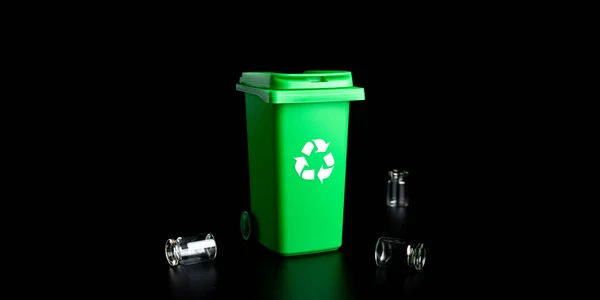 Trash glass sort. Bin container for disposal garbage waste and save environment. Green dustbin for recycle glass can trash isolated on black background. — Stock Photo, Image