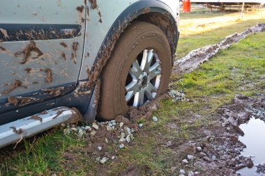 Car stuck in the mud clipart