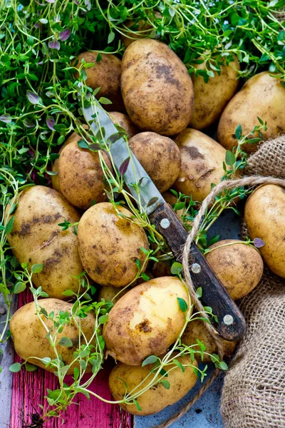 New Potatoes on wooden background — Stock Photo, Image