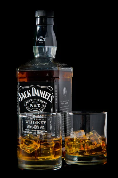 Jack Daniel's whiskey bottle and glass. Jack Daniel's is a brand