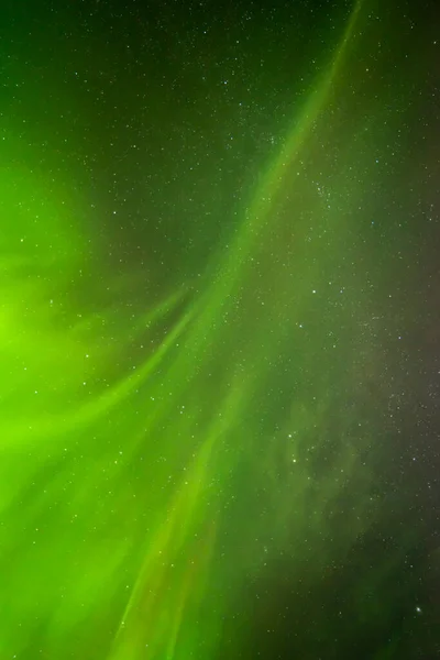 Beautiful northern lights aurora borealis against the background of the starry sky. — Stock Photo, Image